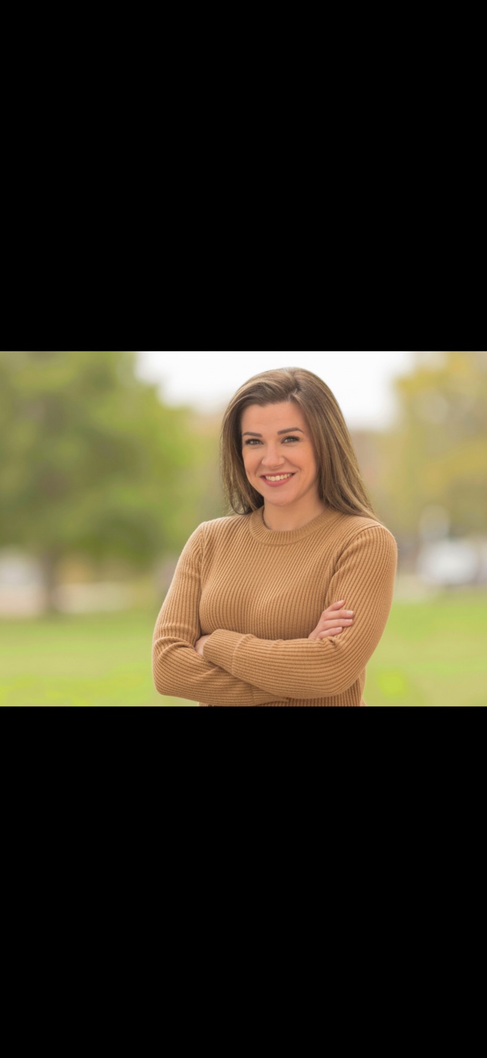 Alesha, owner of Pinky Promised Childcare, smiling outdoors